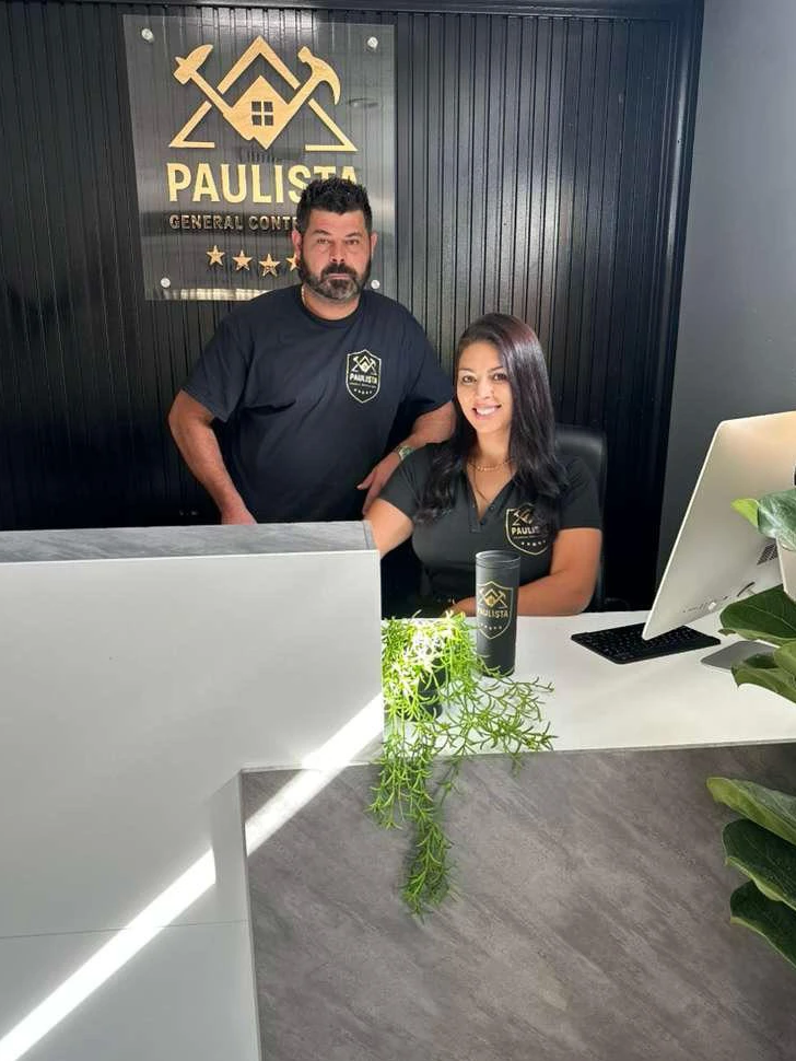 Vanessa and Jacson, owners of Paulista General Contractors, in front of their showroom in Milford MA